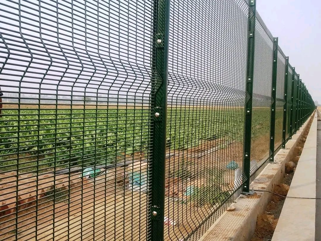 Clear view anti-climb mesh fence installed along a property boundary