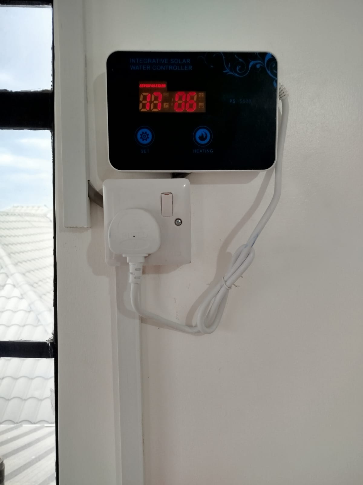 Digital Integrative Solar Water Controller wall-mounted indoors at a property in Katani, displaying tank temperature