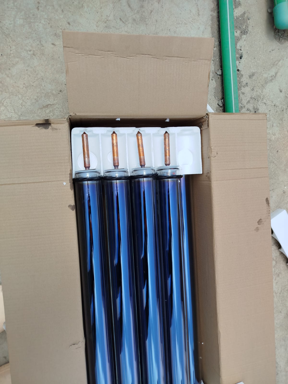 Boxed evacuated glass collector tubes for a 300L solar water heater installation in Katani