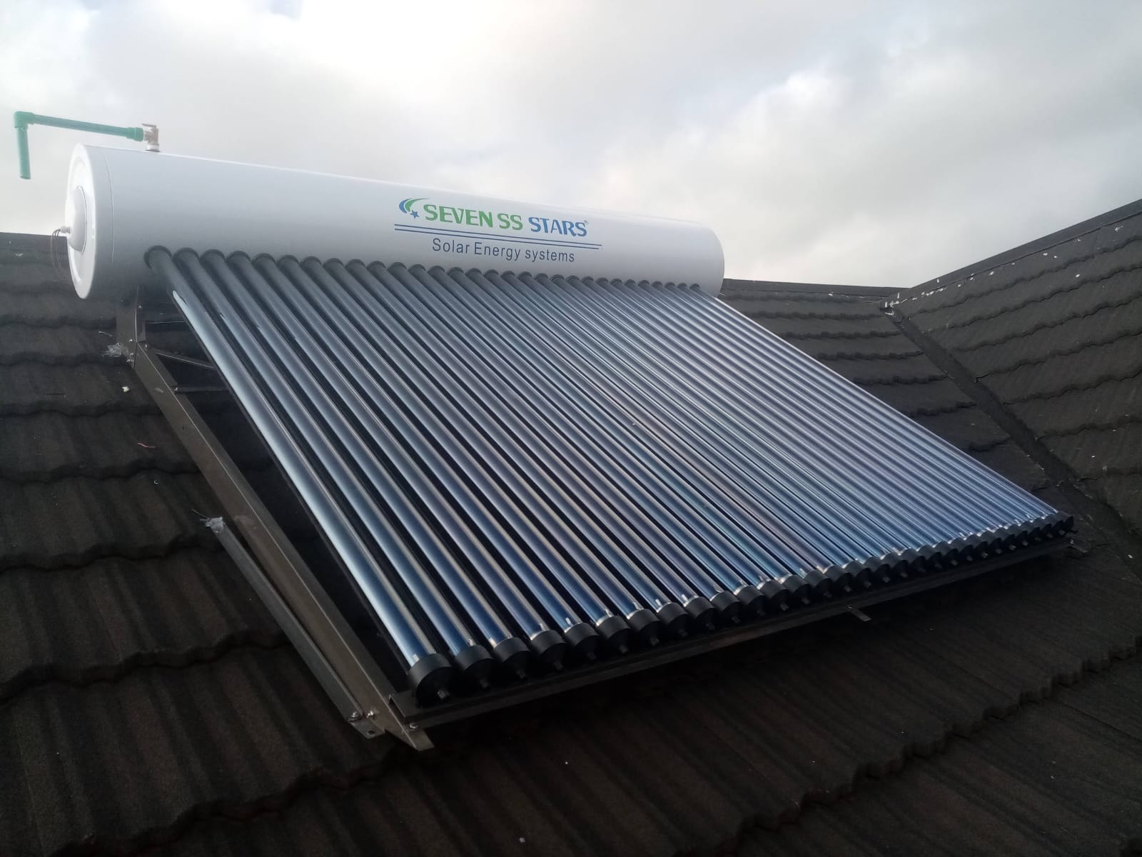 Completed solar water heater tank and collector installation on a Nairobi rooftop