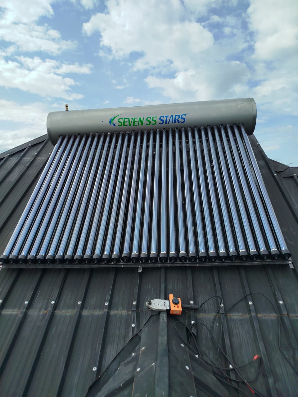 Solar water heater installed on a metal roof